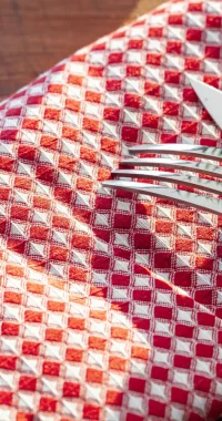 red-checkered-napkin-or-tablecloth-on-wooden-table-2023-11-27-05-32-46-utc