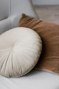 round-and-square-cozy-pillows-on-a-gray-sofa-in-th-2023-11-27-05-33-05-utc